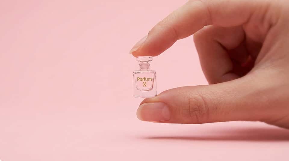 macro photograph, minimalist advertising style, a hyper-realistic miniature [PRODUCT] crafted from [MATERIAL], delicately poised between a person's thumb and forefinger against a seamless, matte [BG_COLOR] cyclorama under professional Top-Down_Spotlight that casts subtle, soft shadows, with the impeccably groomed hand accentuating the object's intricate contours while the composition remains perfectly centered with a shallow depth of field to highlight its exquisite craftsmanship